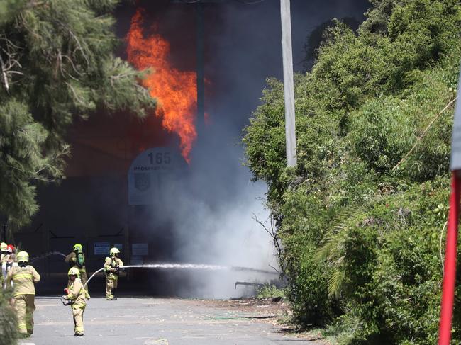 Firefighters battling the blaze. Picture: David Swift