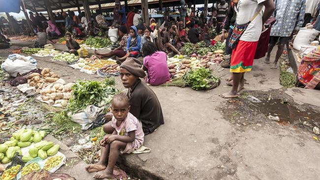 People at the local market of Wamena in Baliem Valley, Papua New Guinea, where a report found: “90 per cent of women in prisons in PNG are serving time for murder. They acted in self-defence in response to family violence.”