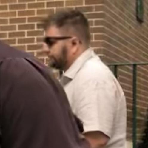 Matthew James Vann (right), 32, of Albion Park, outside Manly Local Court where he pleaded not guilty to assaulting his girlfriend and two counts of stalking or intimidating her. Picture: Manly Daily