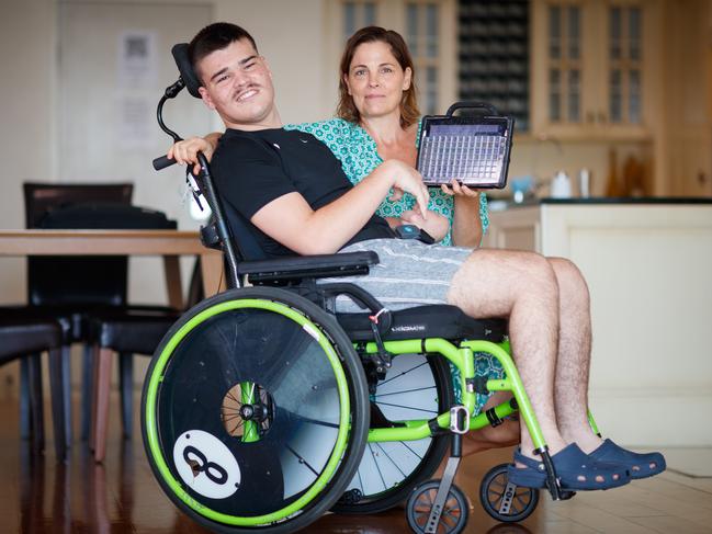 Amanda Coll with her son Finley and the device he uses to communicate. Finley is quadriplegic, has severe cerebral palsy and is non-verbal. He uses as assisted device in order to be able to speak, but the NDIS is refusing to allow him to purchase a new device after his old one broke. Picture Matt Turner.