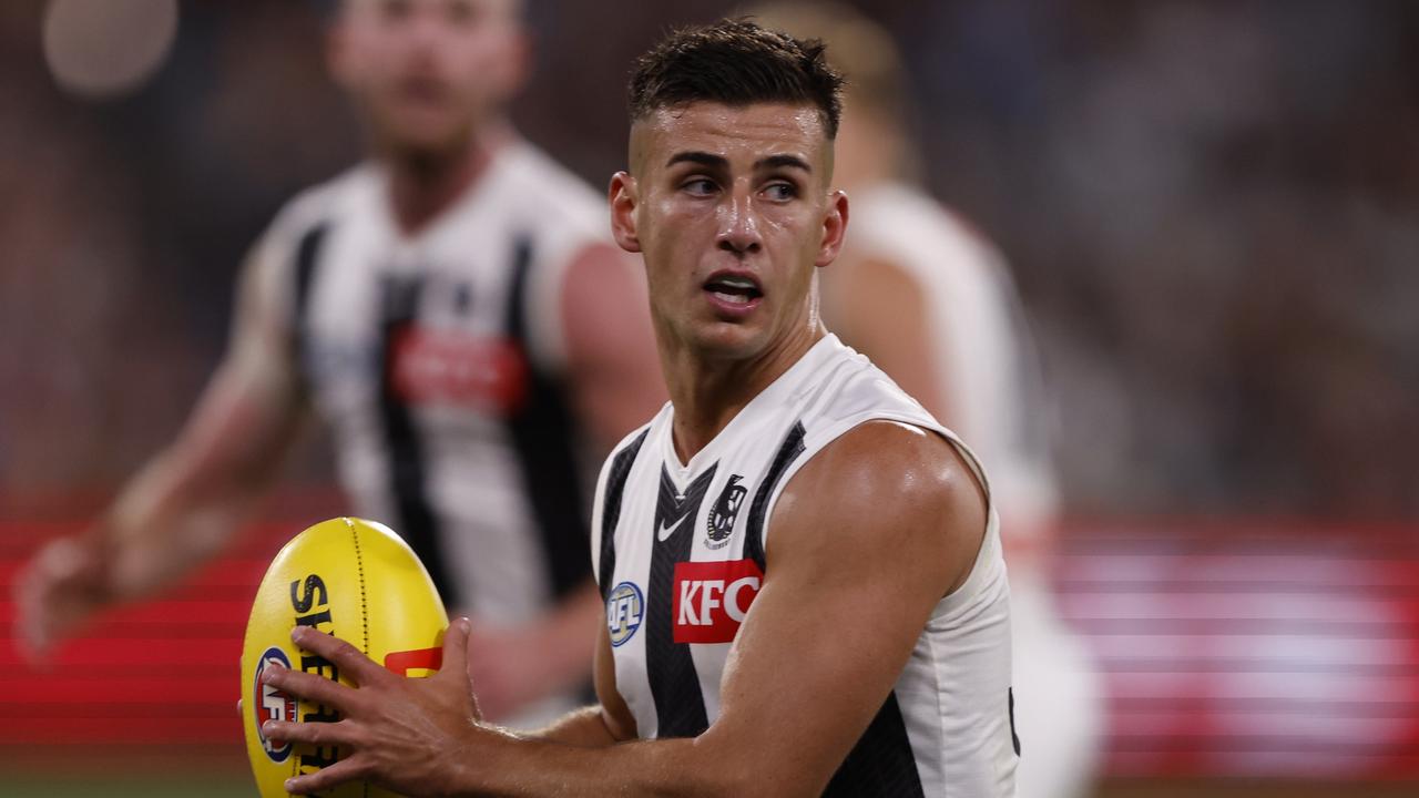 MELBOURNE, AUSTRALIA - MARCH 21: Nick Daicos of the Magpies runs with the ball during the round two AFL match between St Kilda Saints and Collingwood Magpies at Melbourne Cricket Ground, on March 21, 2024, in Melbourne, Australia. (Photo by Darrian Traynor/Getty Images)