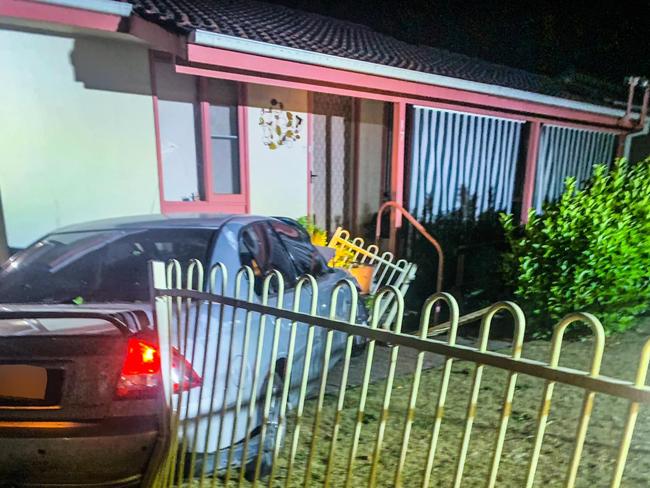 Unlicensed driver charged after crashing unregistered car into house in Raymond Terrace near Newcastle. Picture: SES via NCA NewsWire