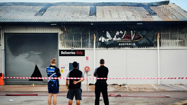 A fire at the UB Cool Air condition warehouse smoulders yesterday morning following a midnight fire at the premises. Picture: JUSTIN KENNEDY