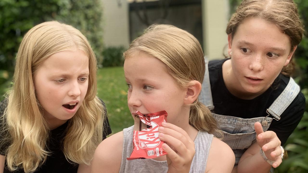 Scarlett O’Connell, 9, keeps an eye on her KitKat chocolates from her 10-year-old sisters Suraya and Lucinda, 12. Picture: Lachlan Miranda