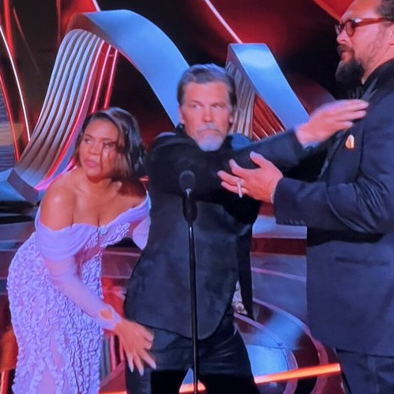 Regina Hall frisks presenter Josh Brolin.