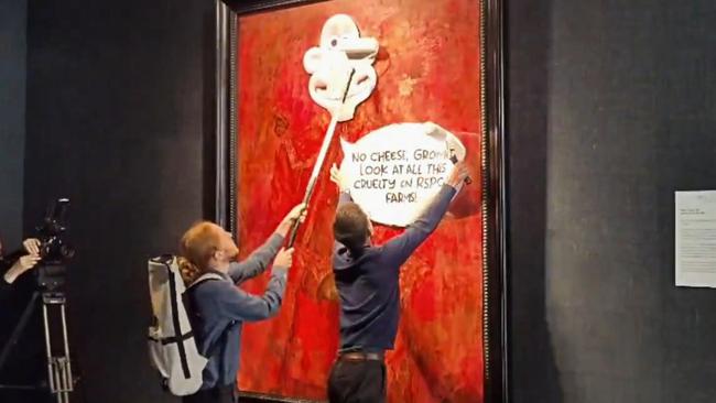 British animal activist movement Animal Rising defaces the new official portrait of King Charles III.