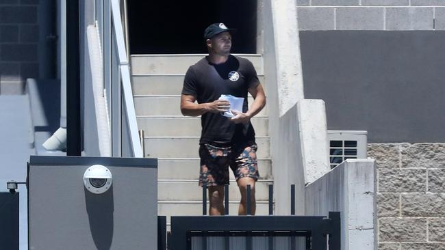 Former Gold Coast Titans player Michael Gordon leaves Tweed Heads police station after being arrested by detectives investigating alleged drug-related offences. Photo: Scott Powick.