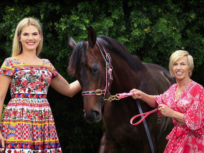 Gold Coast horse trainer Gillian (right) and daughter Tayla Heinrich at their stables with horse Invinsible Tears, which will feature in the Summer Racing Carnival. Picture: Adam Head