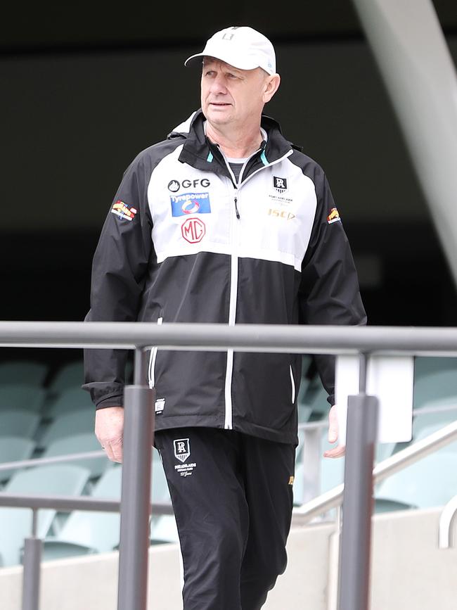 Ken Hinkley makes his way down to ground level at Power training on Wednesday. Picture: Sarah Reed