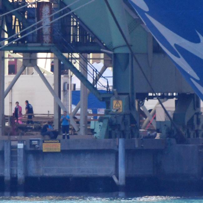 Emergency workers at the gangway ready to escort crew off the ship. Picture: Simon Bullard