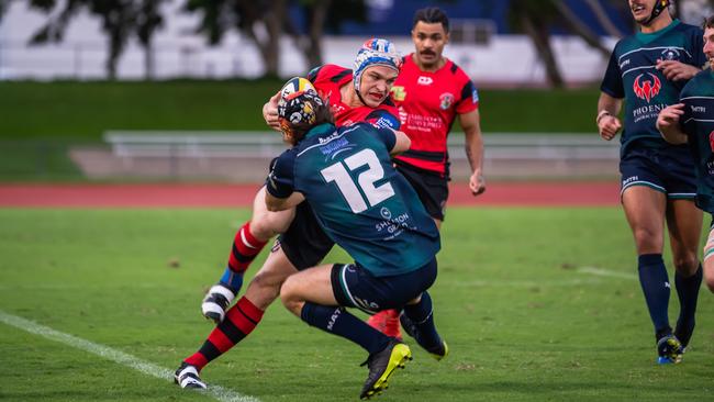 Aengus Dickson and Andrew Pena engage early in the 2021 FNQ Rugby grand final at Barlow Park. Picture: Emily Barker