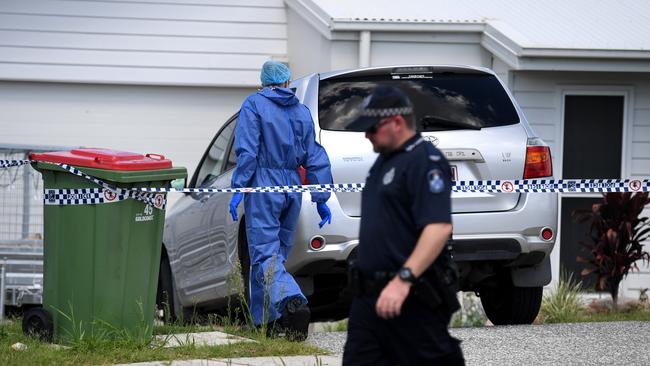 Police forensic officers inspect the property after two bodies were found. Picture: AAP/Dan Peled