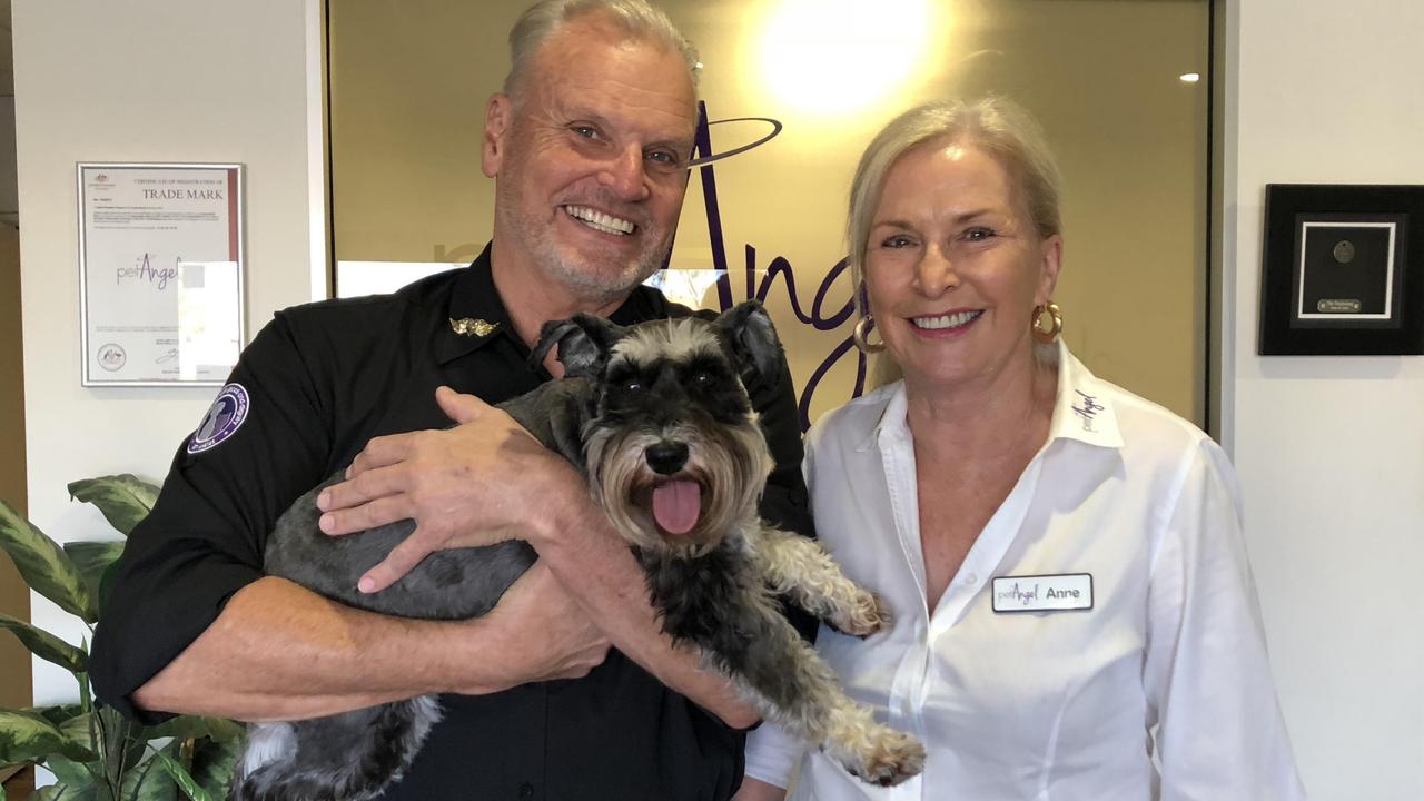 Tom Jorgensen, founder of Pet Angel Funerals, and his wife, Anne, with their pooch Fifi.