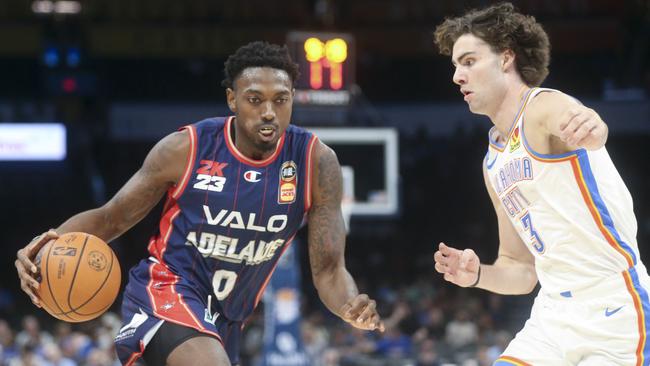 OKLAHOMA CITY, OKLAHOMA - OCTOBER 06: Robert Franks #0 of the Adelaide 36ers dribbles past Josh Giddey #3 of the Oklahoma City Thunder during the second quarter at Paycom Center on October 06, 2022 in Oklahoma City, Oklahoma.   Ian Maule/Getty Images/AFP