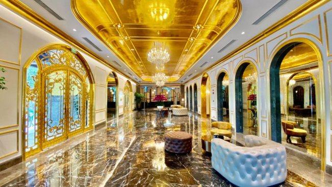 The decadent hotel is fitted out with fancy gold-themed interiors.