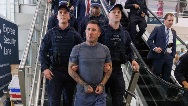 Comanchero boss Allan Meehan has been extradited from Queensland and arrived at Sydney Airport under a heavy police presence. Picture: NCA NewsWire / David Swift