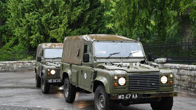 Military vehicles depart through the gates of the Balmoral Estate in Ballater, Scotland on September 8. Picture: AFP