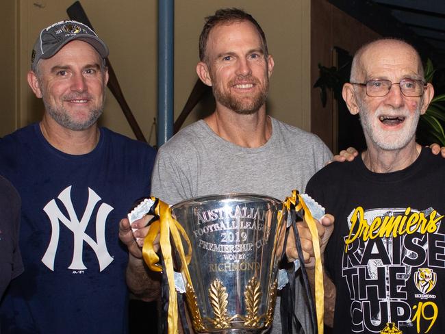 1969 tigers premiership player Michael Bowden and his family with the 2019 premiership cup. Picture: Supplied