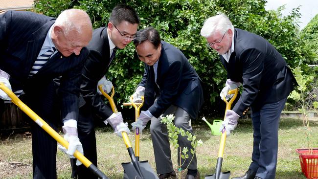 Mayor Bob Manning, Best Beach Resort representative Kevin Zheng, Benny Wu and Deputy Mayor Terry James plant a tree at the Acacia Court Hotel development launch seven years ago – no development has taken place.