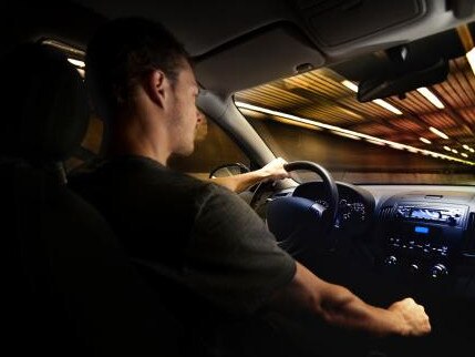 Young Adult Driving Over the Speed Limit in a Tunnel.