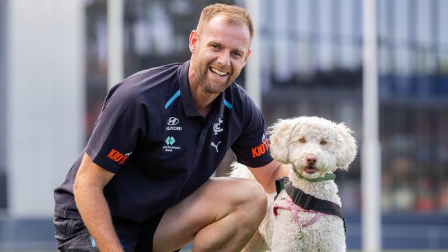 Sam Docherty with Animal Assisted Education Therapy Dog Pebbles. Picture: Jason Edwards