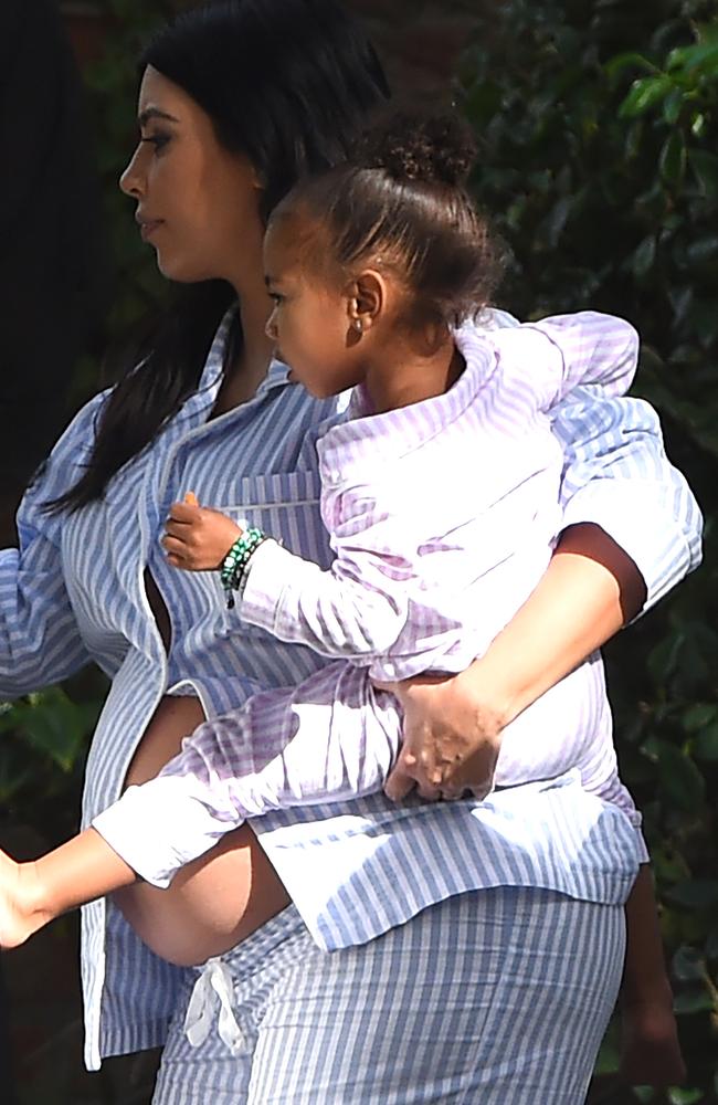 Baby No. 2 ... Kim Kardashian showed off her pregnant belly while carrying her daughter, North West. Picture: Splash News