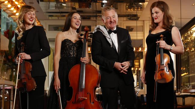 Chef Luke Mangan and Greenhill Strings orchestra members Emma Greenhill, Lily Innis and Emma Jardine at the Sydney CBD restaurant. Picture: Jonathan Ng