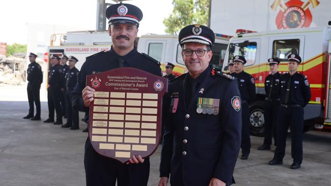 Peter Tognolini receiving his Commissioner’s Award for Dux of the recruit course from QFD Commissioner Steve Smith. Picture: Joshua Preston.