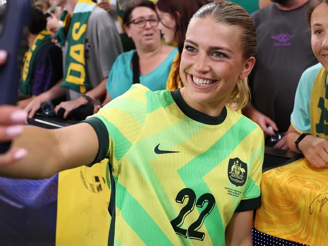 SYDNEY, AUSTRALIA - APRIL 04: Charlotte Grant of Australia takes a selfie with fans after winning the International Friendly between Australia Matildas and Korea Republic at Allianz Stadium on April 04, 2025 in Sydney, Australia. (Photo by Matt King/Getty Images)