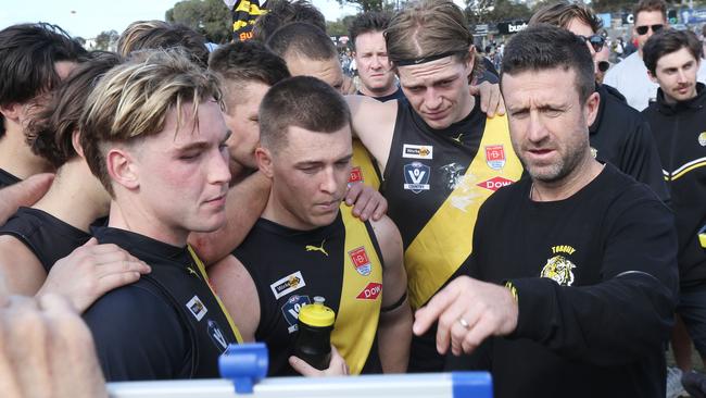 Torquay coach Dom Gleeson instructs his charges, including Baxter Mensch (far left). Picture: Mark Wilson