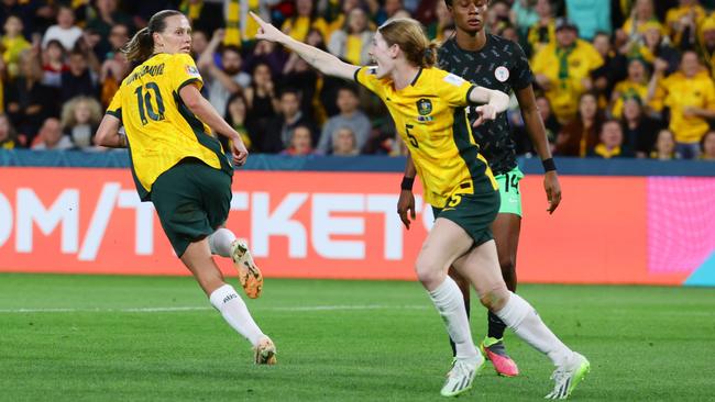 Emily van Egmond celebrates after scoring the first goal