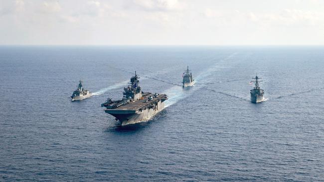 The Royal Australian Navy guided-missile frigate HMAS Parramatta, left, with the US Navy amphibious assault ship USS America, the Ticonderoga-class guided-missile cruiser USS Bunker Hill and the Arleigh-Burke-class guided-missile destroyer USS Barry. Picture: Supplied