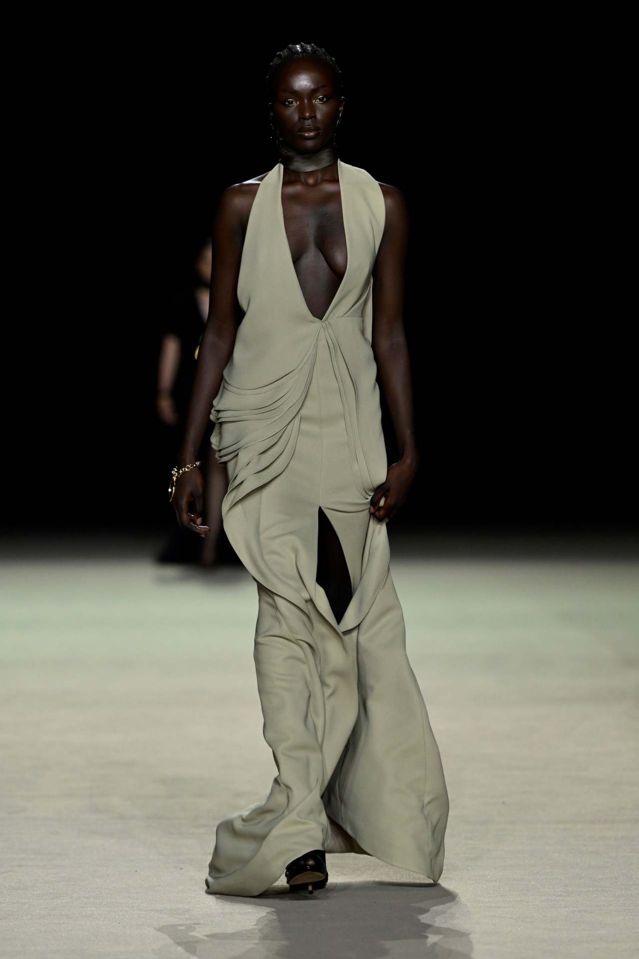 <p>On the runway bearing her name, the label returned to Australian fashion week with Ungar initiating a chapter of modern elegance built thoughtfully on Zampatti&rsquo;s bedrock. Smart tailored vests belted at the waist, jet jumpsuits and pleat front trousers were precisely tailored with a twist: many came with curves, either at the lapel, or sculpted at the bottom in lieu of tails telegraphing a feminine brand of power. These co-mingled with white jacquard opera coats in chalk and black and skirts and chubby jackets with a fringed metallic-flecked thread, an update on feathers&mdash;a very Zampatti signature. Ungar did this consciously, also drawing on jacquards and plumes in the archive&mdash;all a touch &rsquo;70s, the era when Zampatti clothed women for the workforce, and will satisfy the Zampatti faithful (of which there are many).&nbsp;</p>