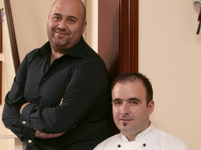 Restaurant owner Somer Sivroglu (in black) with chef Arman Uz.