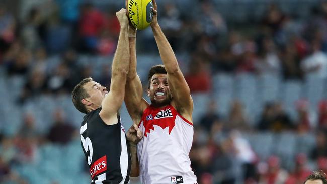 Sydney Swans' Tom Derickx and Collingwood's Nick Maxwell during AFL match Sydney Swans v Collingwood Magpies at ANZ Stadium. pic. Phil Hillyard