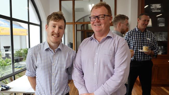 Mr Newman (right) pictured at a College function on Monday welcoming new staff members, just two days before he announced he was taking indefinite personal leave. Photo: Facebook.