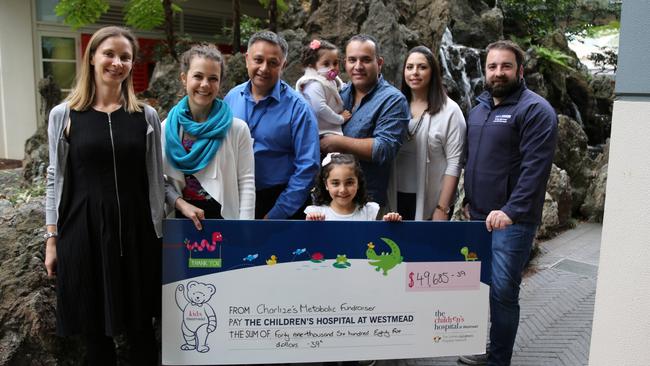 Supporters join members of the Gravina family at the cheque presentation at The Children's Hospital, at Westmead to fund research into genetic diseases.