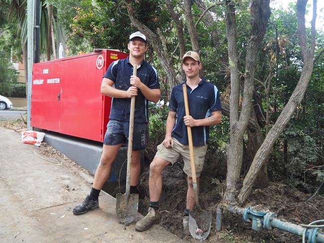 21-year-old fourth-year apprentice plumber (journeyman) Tom Jacobsen and 23-year-old tradesmen Jack Brooks dig up pipes to fix a water leak in Cammeray, Sydney. Picture: Joseph Lam