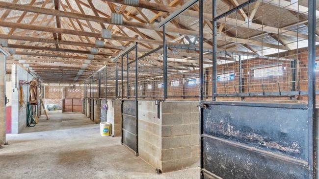 A property with 15 horse stables and a four-bedroom house in Ballina is up for sale.