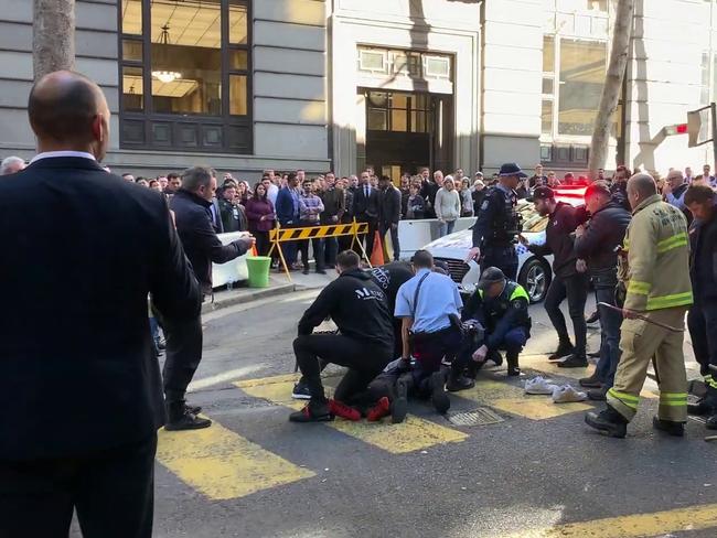 Police apprehend the man near Clarence Street in Sydney. Picture: Marc Kean