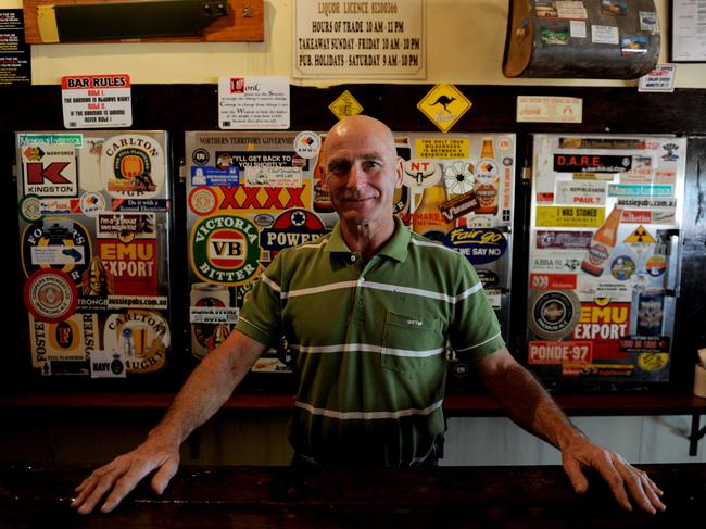 Gary Frost behind the bar at the Dunmarra Roadhouse. Picture: Justin Sanson.