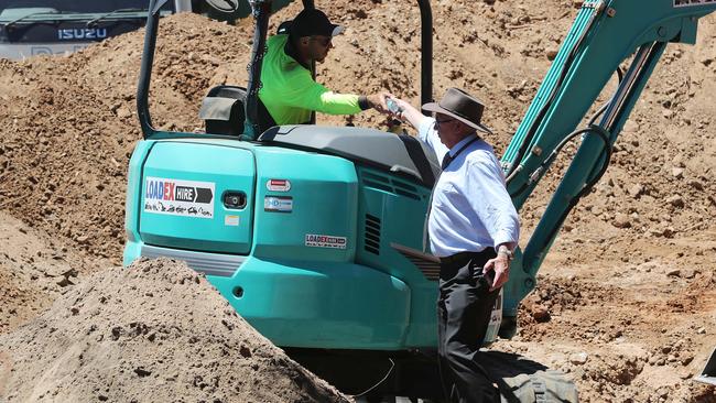 Workers take a water break during the dig at the Castalloy factory for the Beaumont children. Picture: Dylan Coker