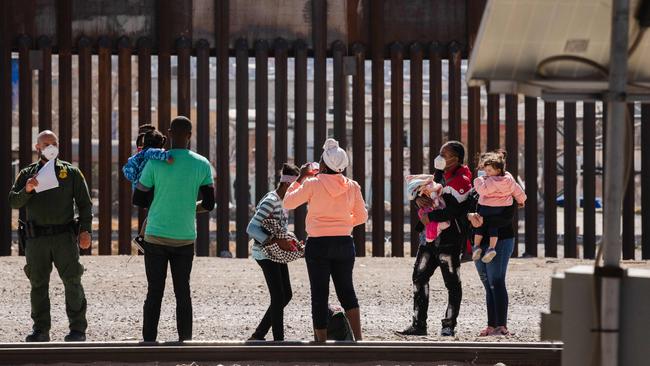 Border Patrol agents apprehend a group of migrants near downtown El Paso, Texas. Picture: AFP