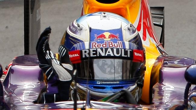 Red Bull driver Daniel Ricciardo of Australia, celebrates his third place at the Monaco Formula One Grand Prix, at the Monaco racetrack, in Monaco, Sunday, May 25, 2014. (AP Photo/Claude Paris)