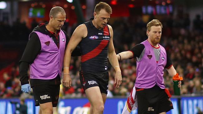 Brendon Goddard hobbles off the ground with a knee injury. Picture: Getty Images