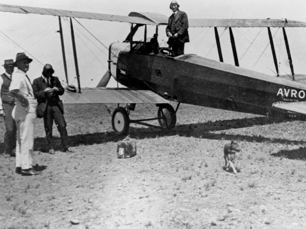 Hudson Fysh stands in an Avro 504K, one of the first planes used by Qld &amp; NT Aerial Service (Qantas) in Winton in 1921.