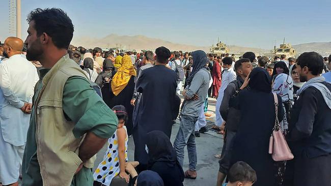 Afghans crowd at the tarmac of the Kabul airport in an effort to flee the country. Picture: AFP