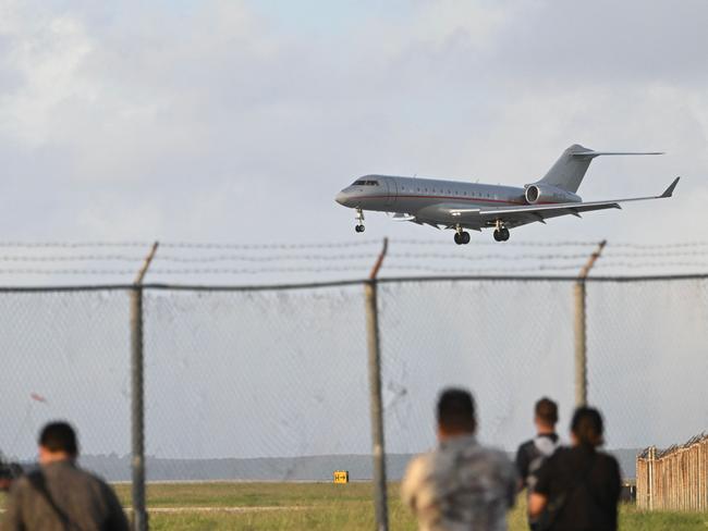 The plane carrying WikiLeaks founder Julian Assange lands at Saipan International Airport. Photo: AFP.