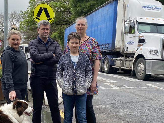 Hahndorf locals Catherine McLeod, with her dog Hunter, Jeremy Roberts, Cathryn Nitschke and son Solomon Nitschke in the Main Street. Picture: Dylan Hogarth