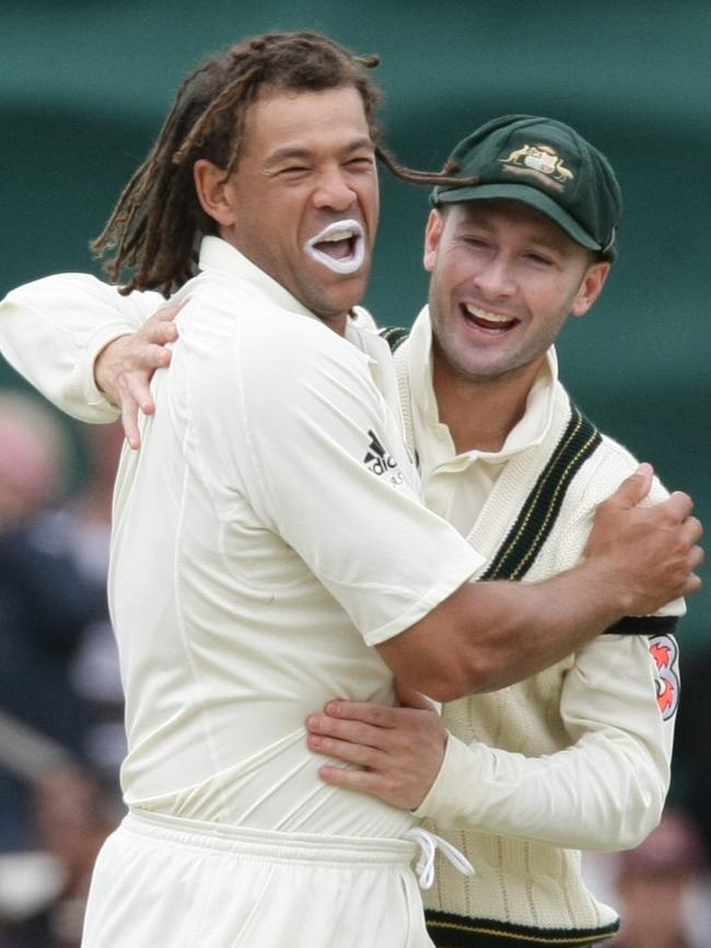 Cricket - Aust vs NZ first day of Second Test match at Adelaide Oval - cricketer Michael Clarke congratulates Andrew Symonds on getting the wicket of Peter Fulton.